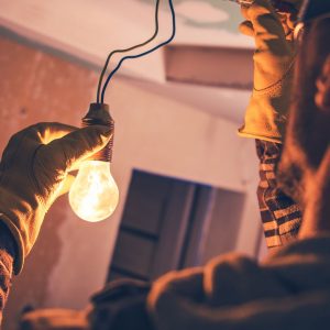 Electrician holding a bulb