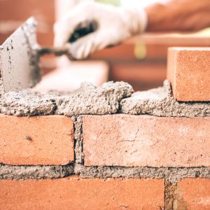 Contractor working on wall