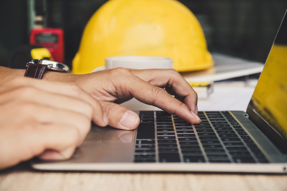 Man typing on laptop