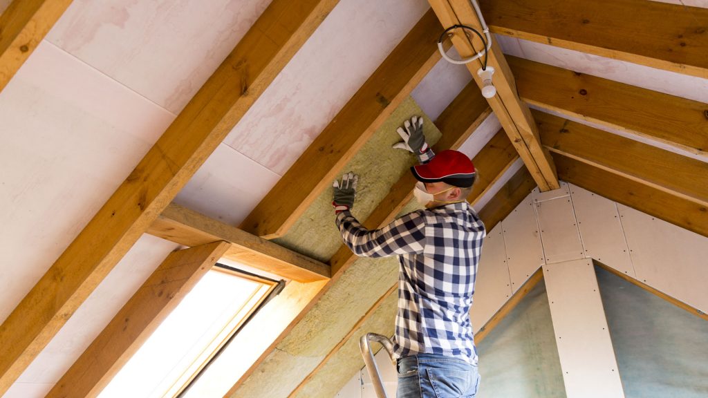 Image of a contractor working on the inside of a roof