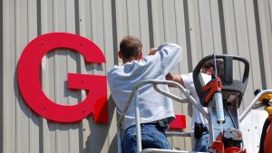 Image of a contractor working on a electric sign