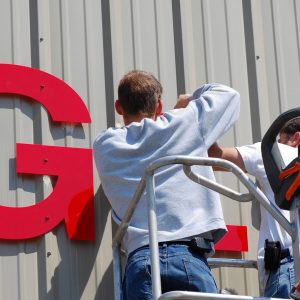 Image of a contractor working on a electric sign